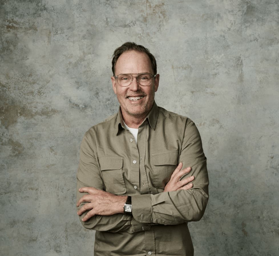 Portrait of Brent Wallace in an olive shirt