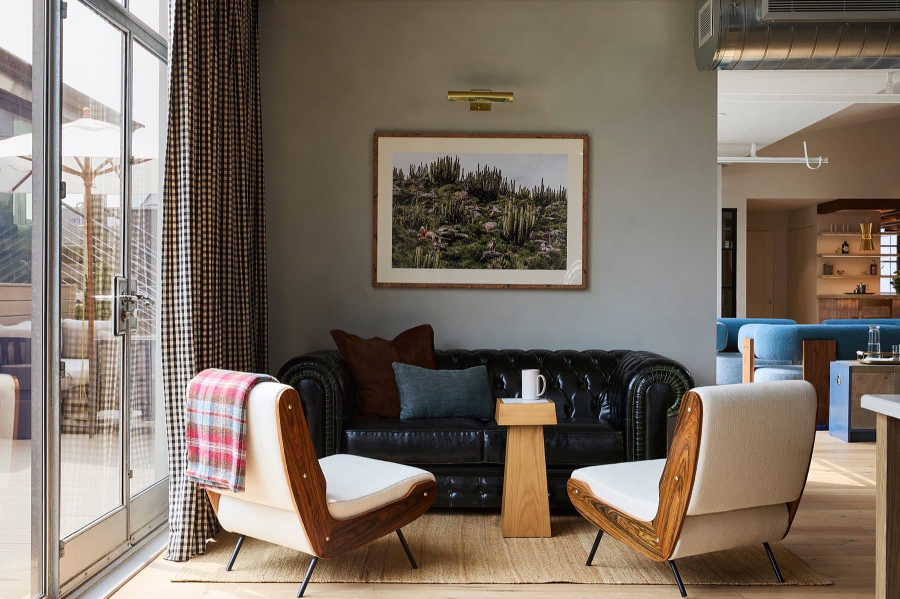 Two armchairs and a sofa in a SmartFlyer office lounge