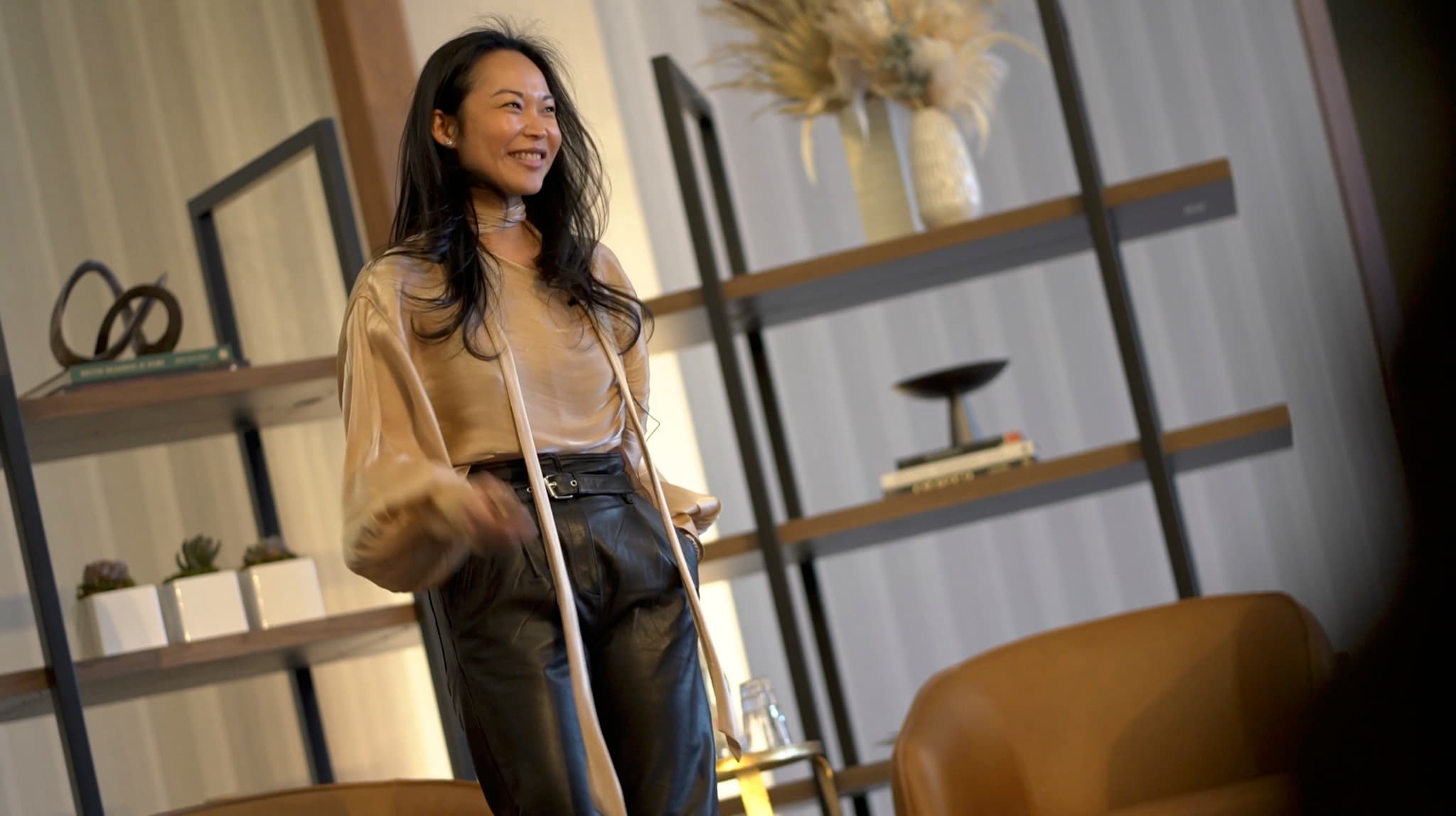 A SmartFlyer advisor smiling in front of a bookshelf